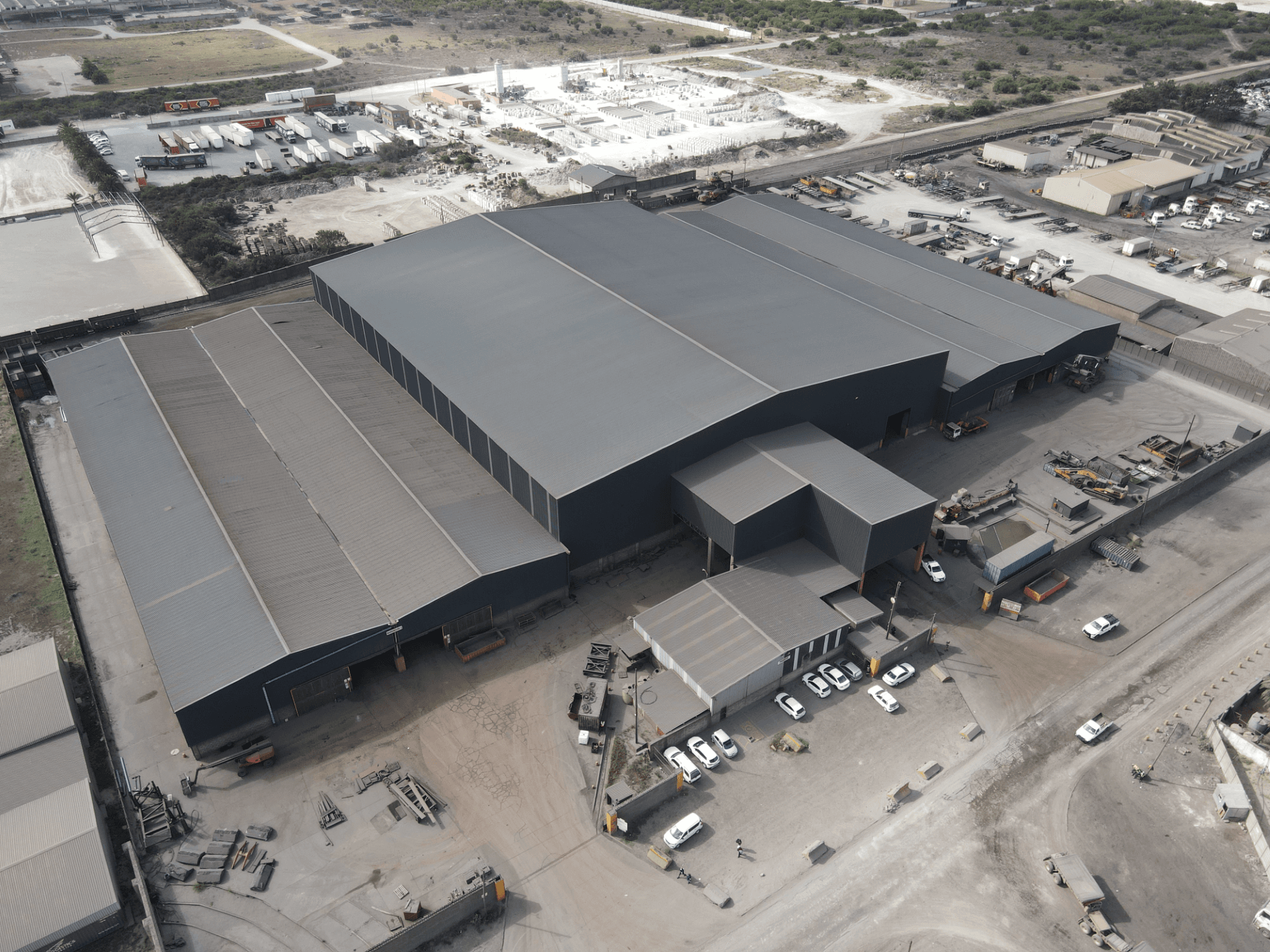 Aerial view of a large warehouse and industrial yard